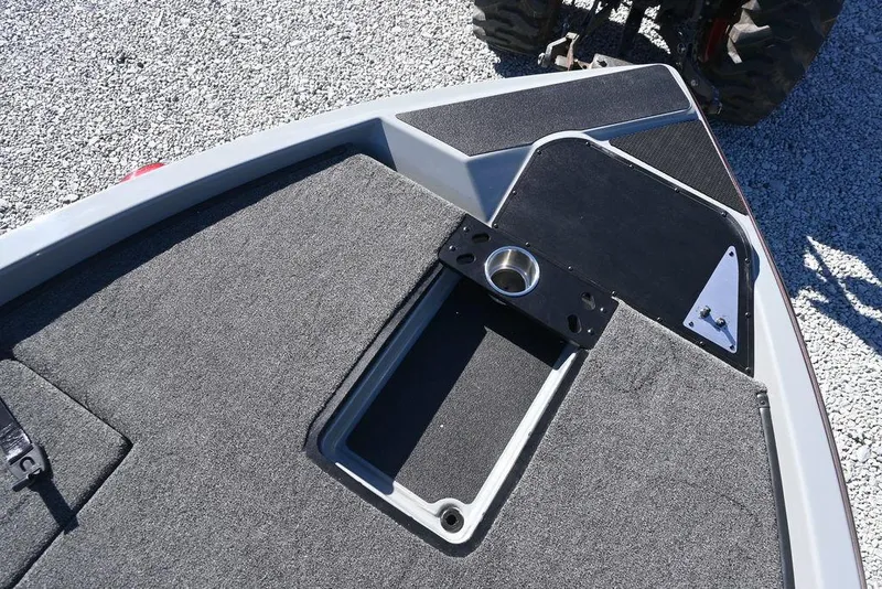 Slide: The Image of 2025 Caymas 201 Pro boat deck with carpeted surface and metal fittings. - 9