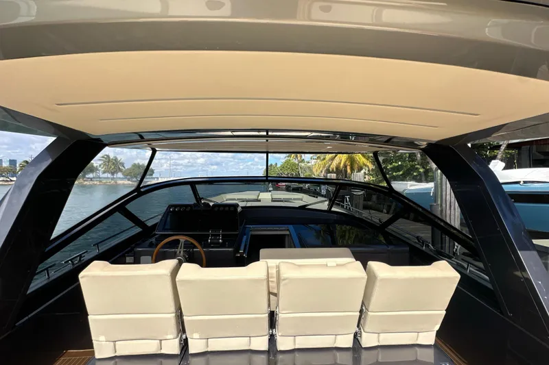 Slide: The Image of Interior view of 2019 CNM 54 yacht with modern seating and steering wheel. - 15