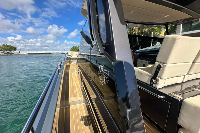 Slide: The Image of Luxurious CNM 54 yacht deck with sleek design, cruising on a sunny day, 2019 model. - 26