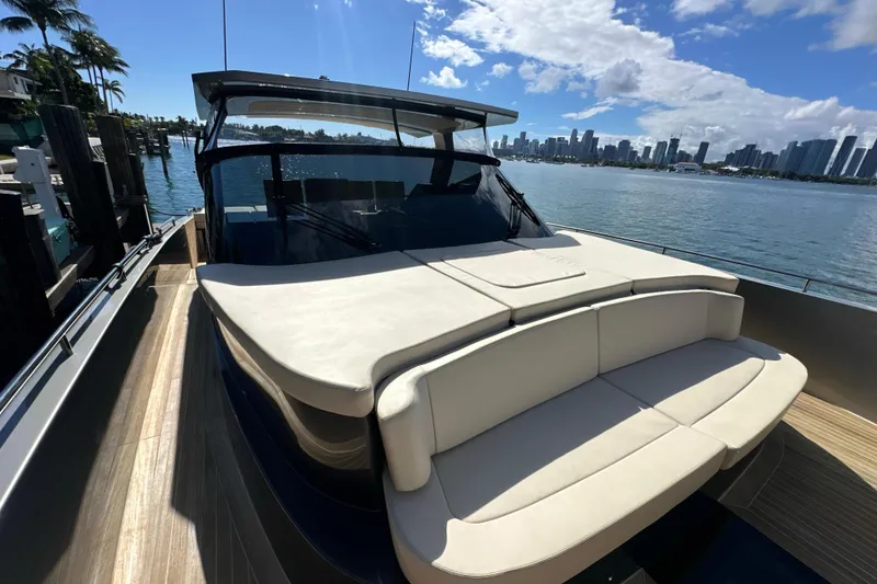 Slide: The Image of Luxurious 2019 CNM 54 yacht docked with city skyline in background. - 30