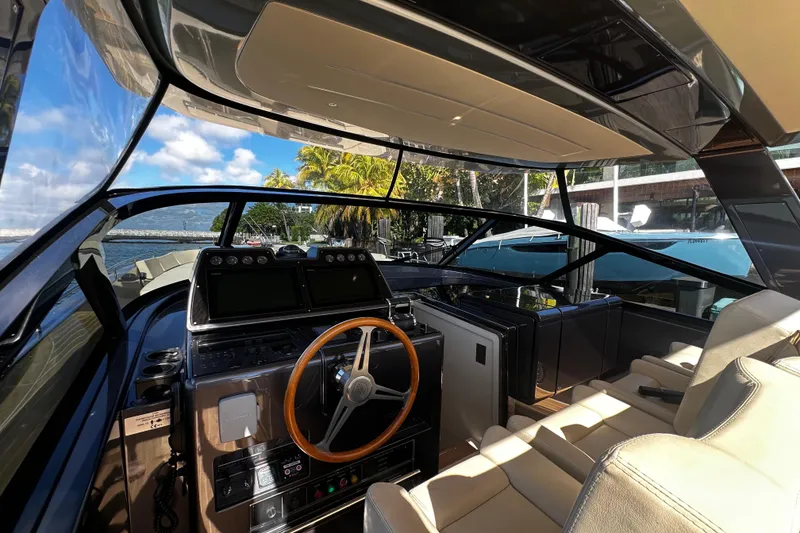 Slide: The Image of Interior of 2019 CNM 54 yacht with modern dashboard and scenic ocean view. - 31
