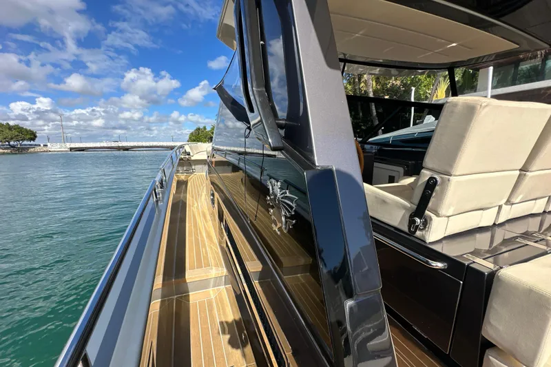 Slide: The Image of Luxurious CNM 54 yacht deck with sleek design, cruising on a sunny day, 2019 model. - 35