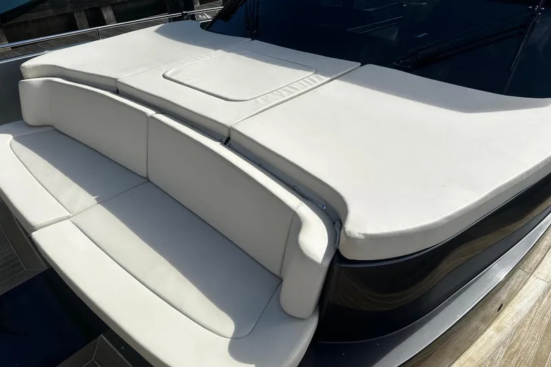 Slide: The Image of Luxurious seating on 2019 CNM 54 yacht with sleek white cushions. - 5