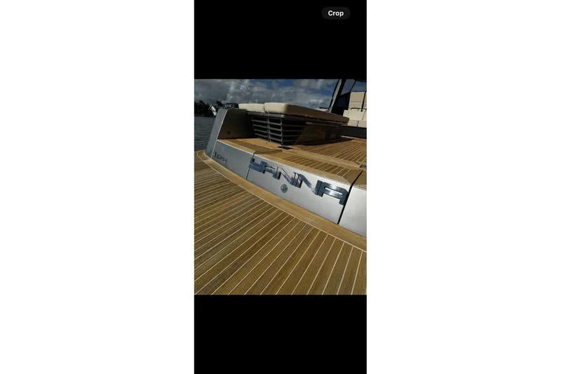 Slide: The Image of Luxury CNM 54 yacht deck, 2019 model, with sleek wooden finish. - 6