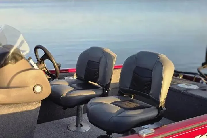 Slide: The Image of 2021 Tracker Super Guide V-16 SC boat interior with two cushioned seats. - 15