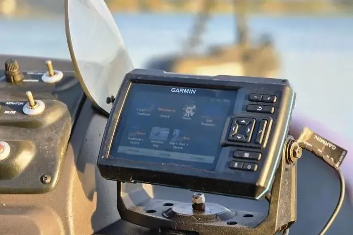 Slide: The Image of Garmin GPS device on 2021 Tracker Super Guide V-16 SC boat dashboard. - 18