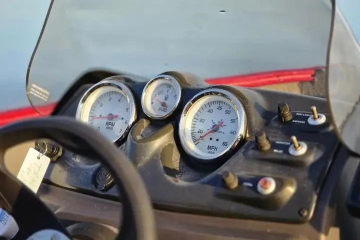 Slide: The Image of Dashboard of 2021 Tracker Super Guide V-16 SC boat with gauges and controls. - 19