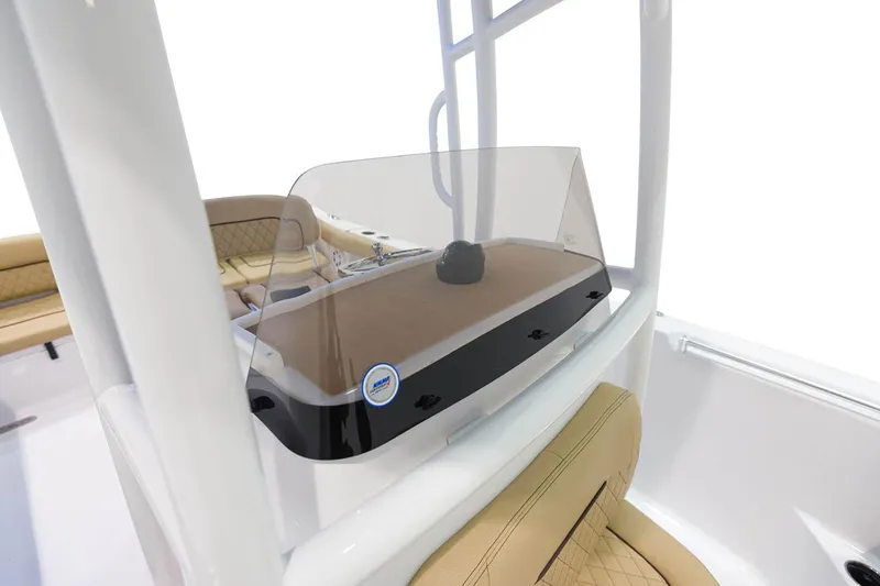 Slide: The Image of 2023 Sportsman Heritage 231 Center Console boat with open storage compartments. - 11