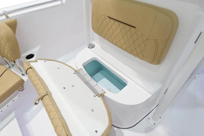 Slide: The Image of 2023 Sportsman Heritage 231 Center Console boat with spacious seating and table. - 13