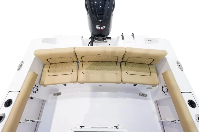 Slide: The Image of 2023 Sportsman Heritage 231 Center Console boat storage compartment open. - 17