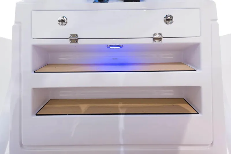 Slide: The Image of 2023 Sportsman Heritage 231 Center Console boat's open storage compartment. - 20