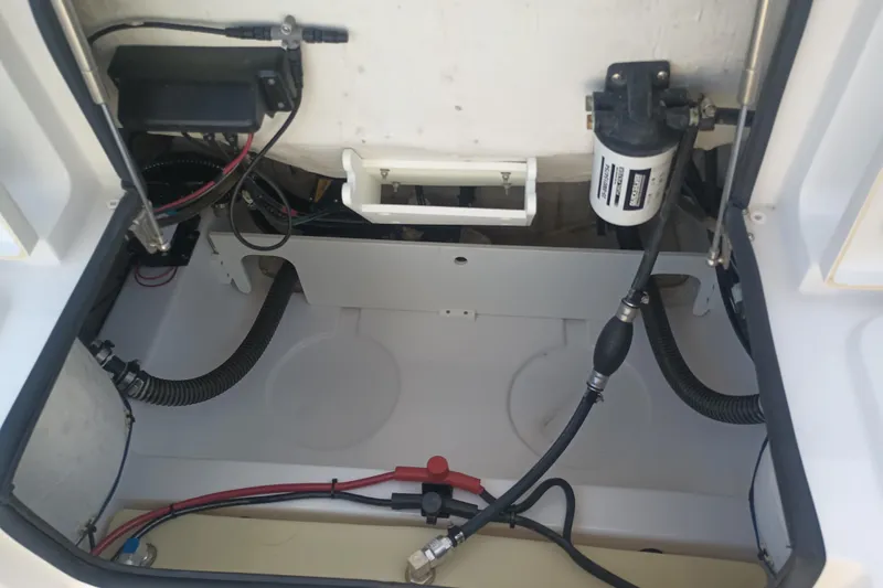 Slide: The Image of 2023 Sportsman Heritage 231 Center Console boat interior wiring and components. - 25