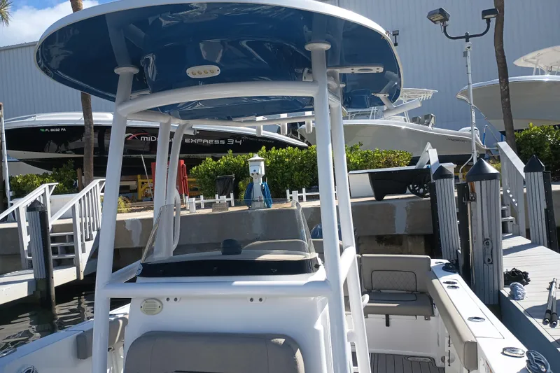Slide: The Image of 2023 Sportsman Heritage 231 Center Console boat docked at marina. - 28