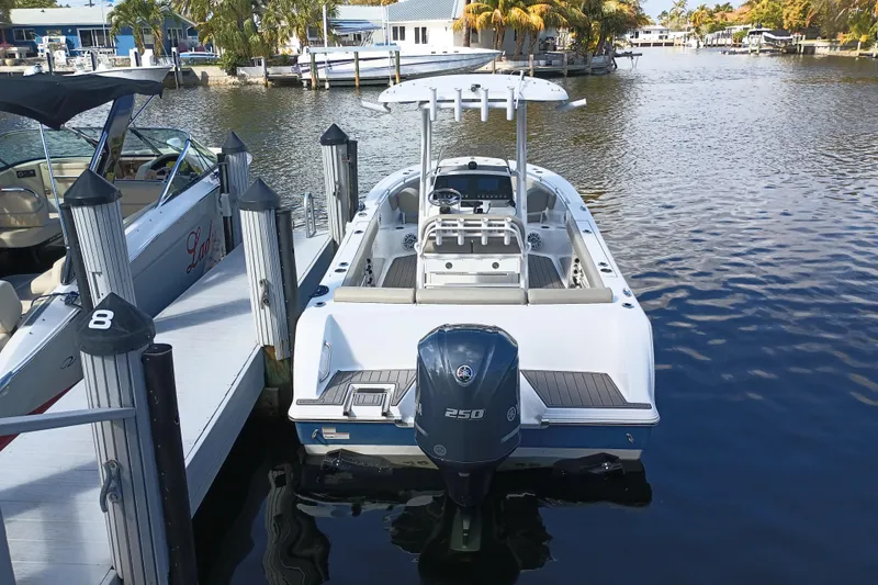 Slide: The Image of 2023 Sportsman Heritage 231 Center Console boat docked at marina. - 29