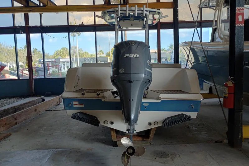 Slide: The Image of 2023 Sportsman Heritage 231 Center Console boat with Yamaha 250 engine in a showroom. - 3