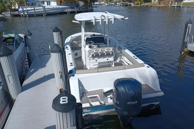 Slide: The Image of 2023 Sportsman Heritage 231 Center Console boat docked at marina. - 30