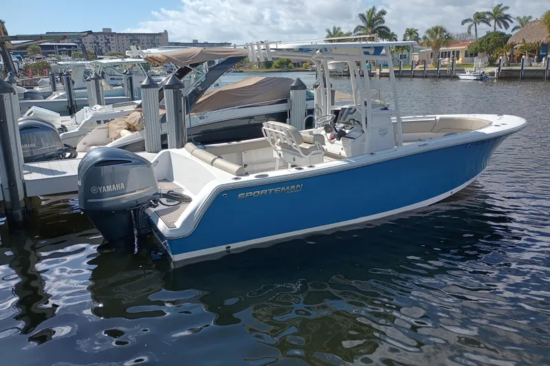 Slide: The Image of 2023 Sportsman Heritage 231 Center Console boat docked, featuring Yamaha outboard motor. - 31