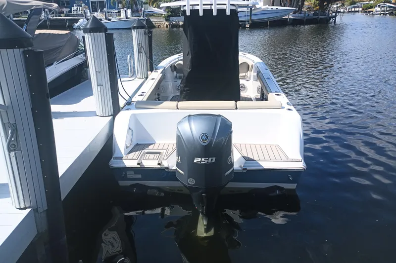 Slide: The Image of 2023 Sportsman Heritage 231 Center Console boat docked with Yamaha 250 engine. - 41