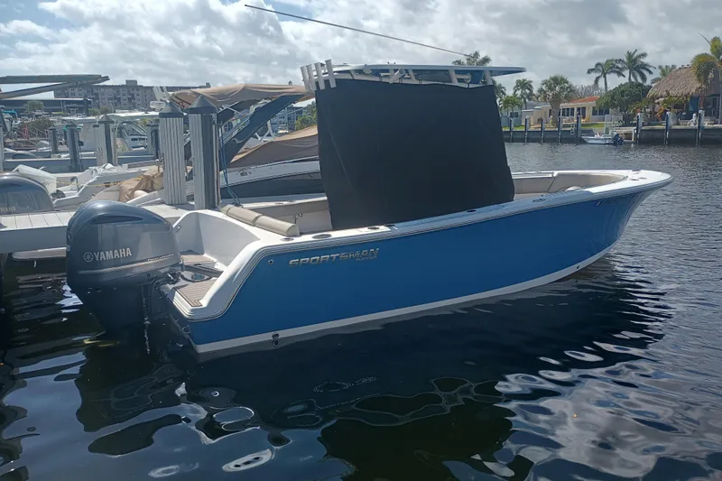 Slide: The Image of 2023 Sportsman Heritage 231 Center Console boat docked with Yamaha engine. - 42