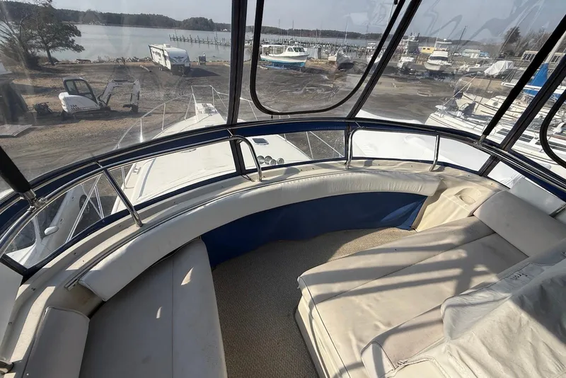 Slide: The Image of 1990 Silverton 37 Convertible boat interior with spacious seating and panoramic view. - 10