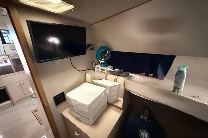 Slide: The Image of Interior of 1990 Silverton 37 Convertible with TV, storage, and fan. - 23