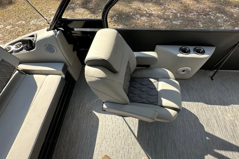 Slide: The Image of 2023 Bennington LX 26 Swingback interior with plush seating and modern design. - 12