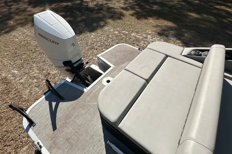 Slide: The Image of 2023 Bennington LX 26 Swingback with Mercury outboard engine, rear seating view. - 9