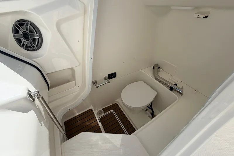 Slide: The Image of 2026 World Cat 265 DC-X boat interior with toilet and speaker. - 14