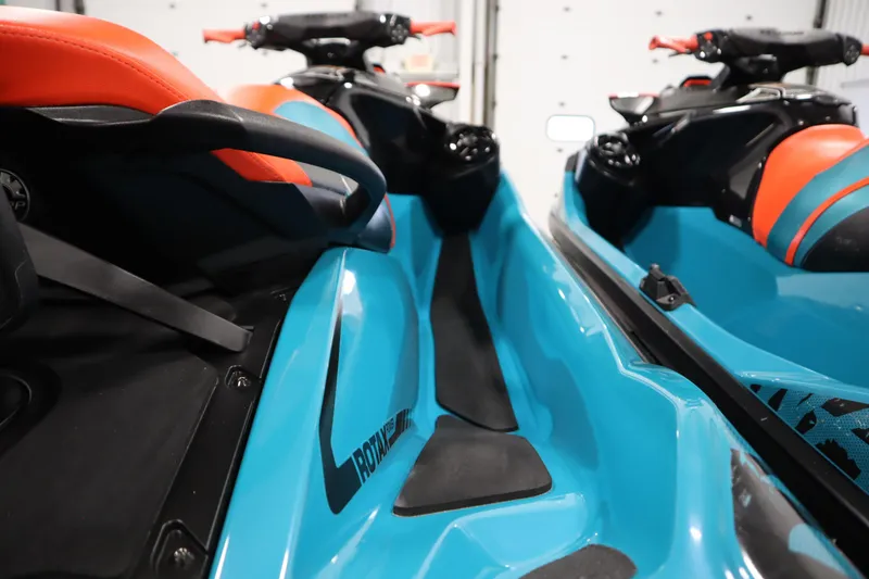 Slide: The Image of 2019 Sea-Doo Wake Pro 230 jet ski, vibrant blue and orange design, close-up view. - 17