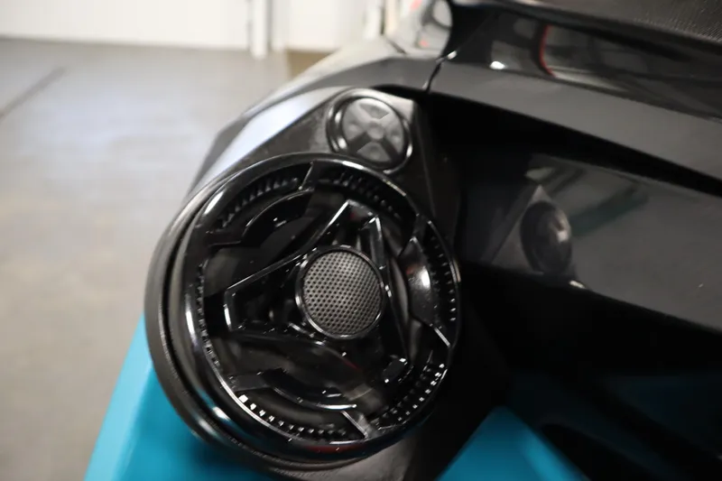 Slide: The Image of Close-up of 2019 Sea-Doo Wake Pro 230 speaker detail in a garage setting. - 18