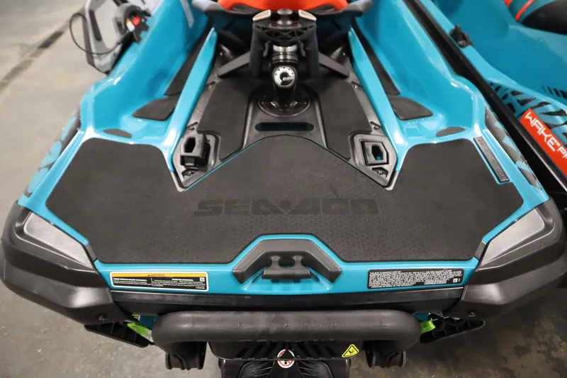Slide: The Image of 2019 Sea-Doo Wake Pro 230, blue and black design, rear view with logo visible. - 19