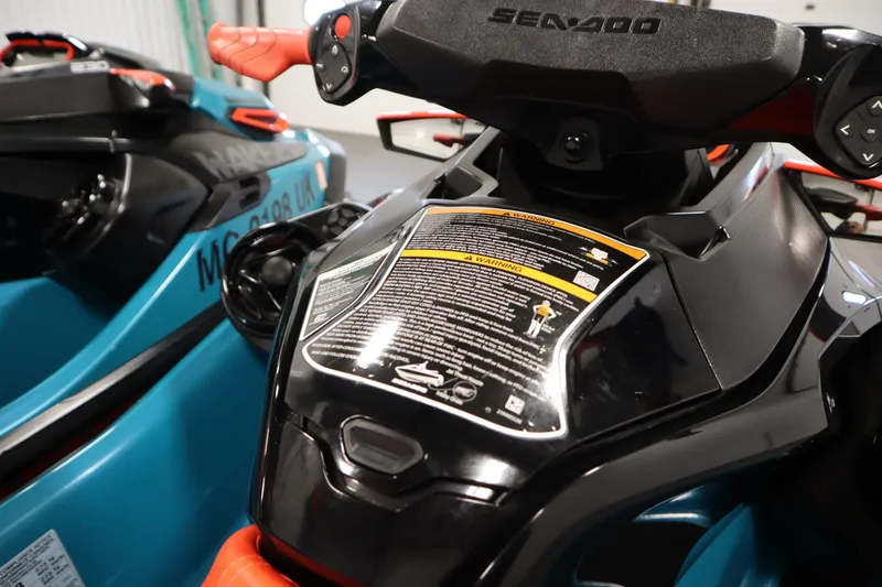 Slide: The Image of 2019 Sea-Doo Wake Pro 230 jet ski dashboard with warning labels and controls. - 26