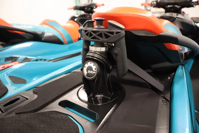 Slide: The Image of 2019 Sea-Doo Wake Pro 230 jet ski with vibrant blue and orange design. - 29