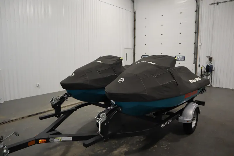 Slide: The Image of 2019 Sea-Doo Wake Pro 230 jet skis on trailer in indoor storage. - 34