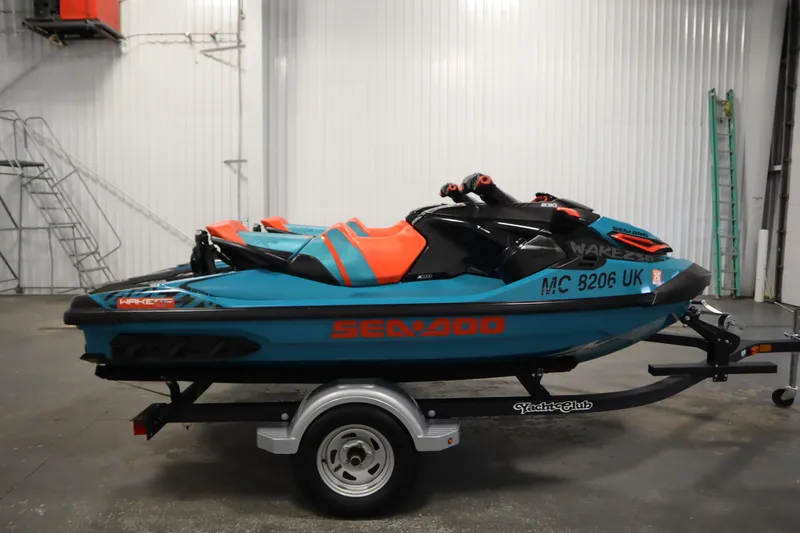 Slide: The Image of 2019 Sea-Doo Wake Pro 230 jet ski on trailer in indoor setting. - 4