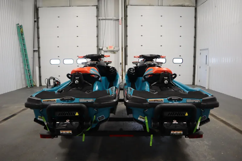 Slide: The Image of 2019 Sea-Doo Wake Pro 230 jet skis in a garage setting. - 6