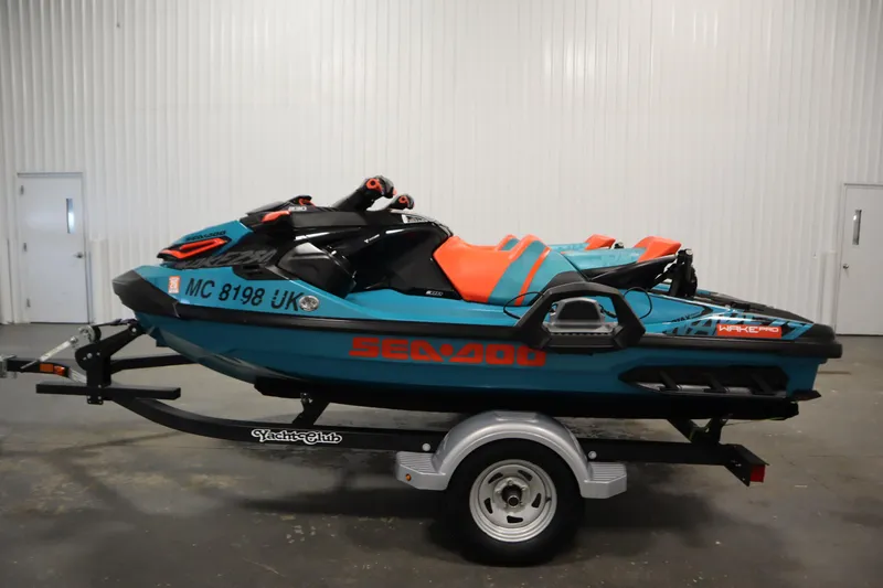 Slide: The Image of 2019 Sea-Doo Wake Pro 230 jet ski on trailer in indoor setting. - 8