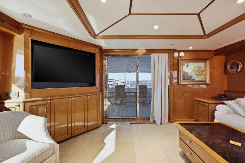 Slide: The Image of Luxurious interior of 2008 Cheoy Lee 95 Motor Yacht with elegant wood paneling and large TV. - 32