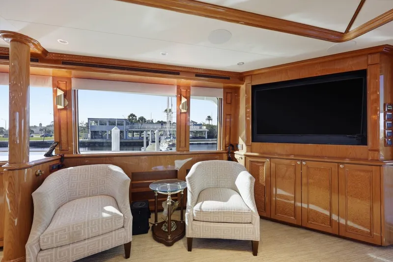 Slide: The Image of Luxurious interior of 2008 Cheoy Lee 95 Motor Yacht with elegant seating and large TV. - 34