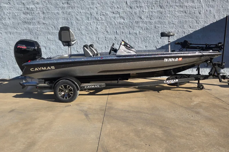 The Image of 2023 Caymas CX 18 SS fishing boat on trailer, parked outdoors. - 1