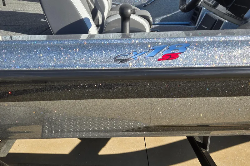 Slide: The Image of 2023 Caymas CX 18 SS boat with sparkling exterior and sleek interior design. - 3