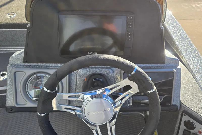 Slide: The Image of 2023 Caymas CX 18 SS dashboard with steering wheel and Garmin display. - 5