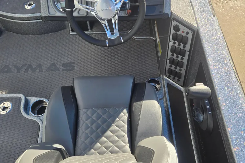 Slide: The Image of 2023 Caymas CX 18 SS boat interior with steering wheel and control panel. - 6