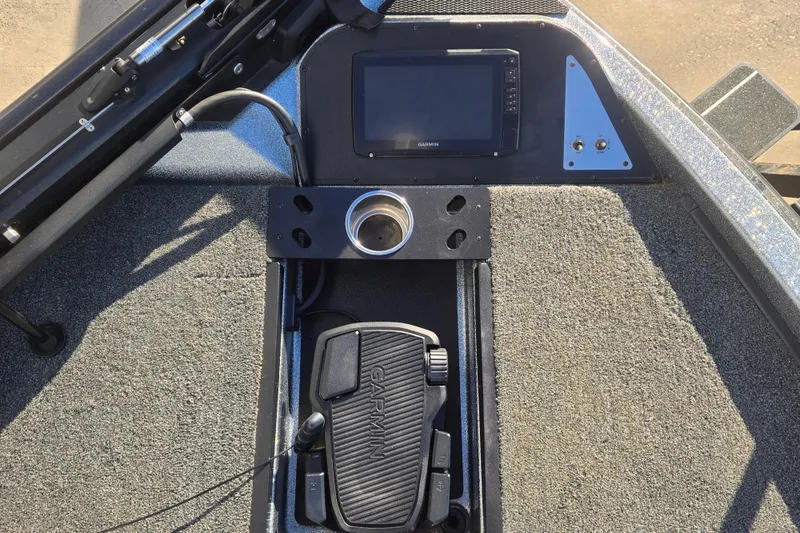 Slide: The Image of 2023 Caymas CX 18 SS boat dashboard with Garmin display and foot pedal. - 8
