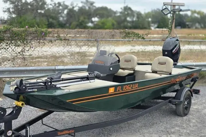 The Image of 2025 Bass Tracker III Classic fishing boat on trailer, green with beige seats. - 1