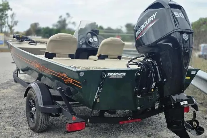 Slide: The Image of 2025 Bass Tracker III Classic boat with Mercury 50 engine on a trailer. - 11