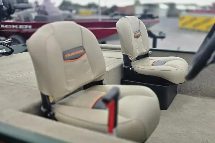Slide: The Image of 2025 Bass Tracker III Classic boat seats, beige upholstery, outdoor setting. - 15