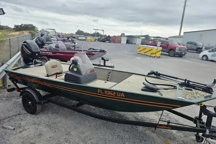 Slide: The Image of 2025 Bass Tracker III Classic boat on trailer in parking lot. - 5