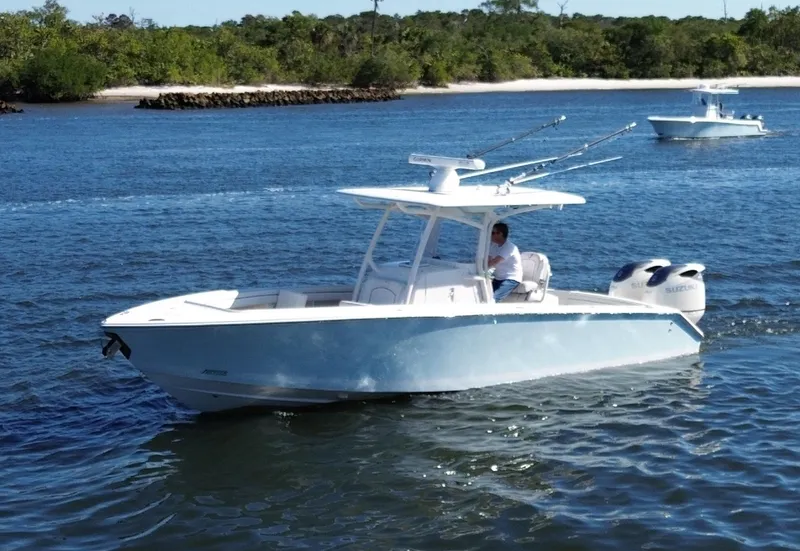 Slide: The Image of 2015 Jupiter 30 FS boat cruising on a scenic waterway. - 2
