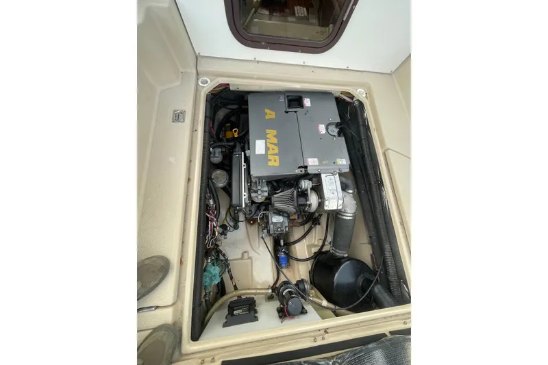Slide: The Image of Engine compartment of 2012 Ranger Tugs R-27 boat, showcasing mechanical components. - 20